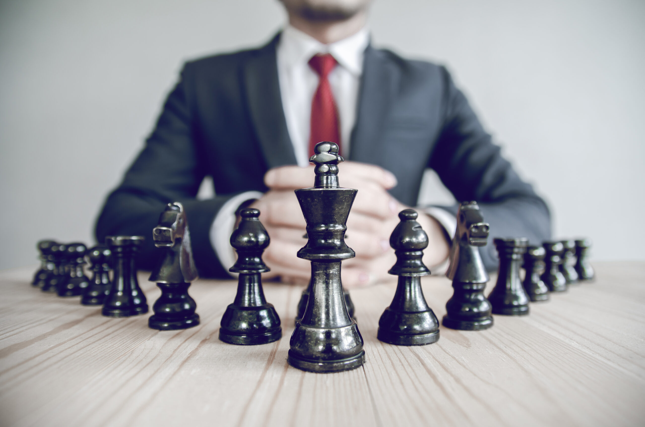 Retro style image of a businessman with clasped hands planning s